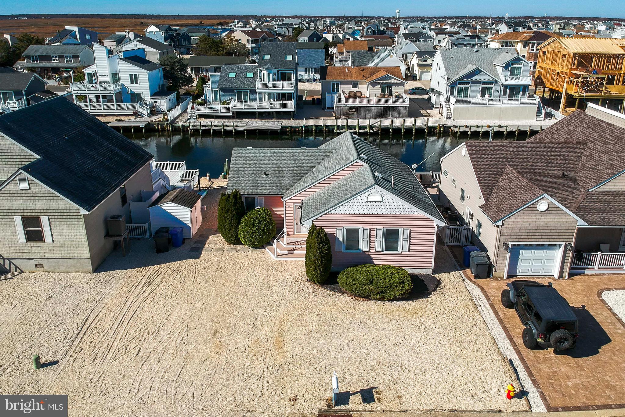 28 Diane Road Manahawkin, NJ 08050 - Photo 40 of 46 a view of a house next to a lake