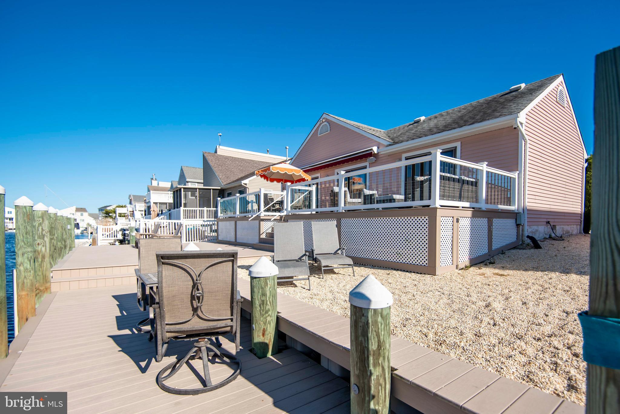 28 Diane Road Manahawkin, NJ 08050 - Photo 7 of 46 a view of a deck with chair and table
