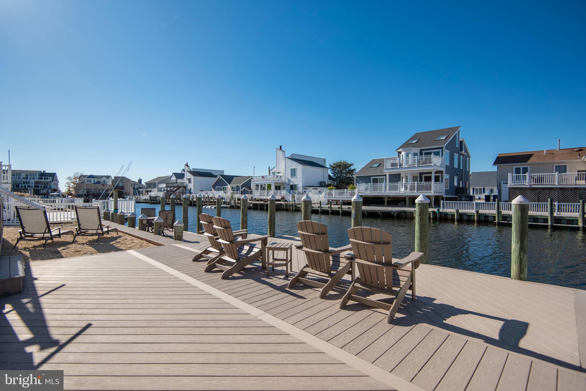 28 Diane Road Manahawkin, NJ 08050 - Photo 8 of 46 a view of a lake with boats and trees in the background