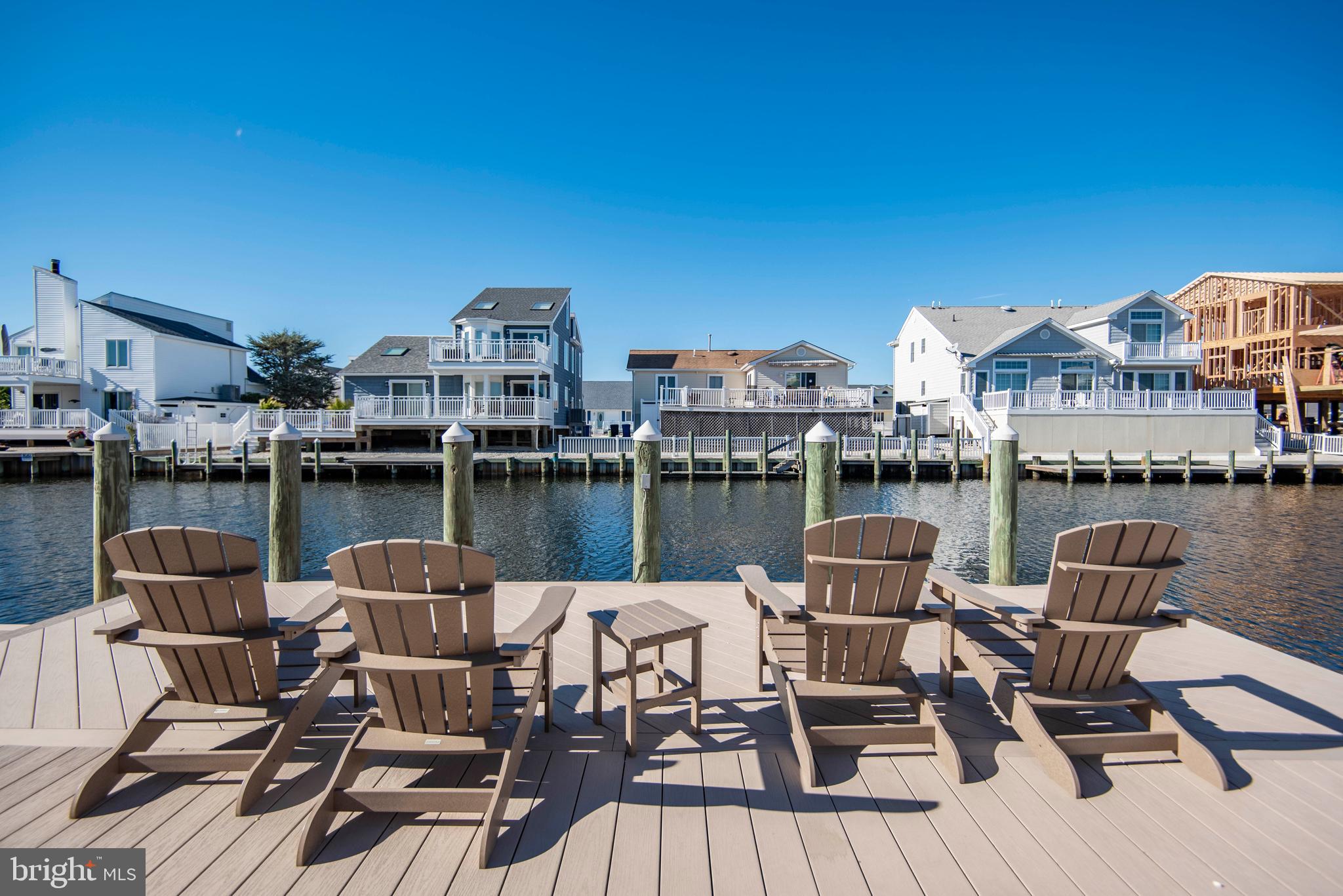 28 Diane Road Manahawkin, NJ 08050 - Photo 9 of 46 a view of a lake with furniture and city view