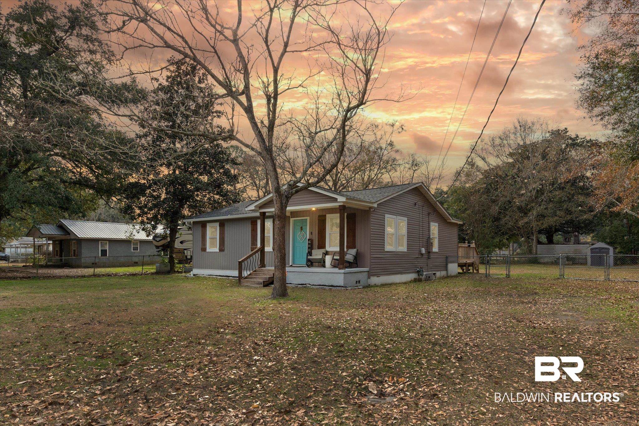 419 Pierce Street Saraland, AL 36571 - Photo 1 of 21 Exterior space with a yard and covered porch