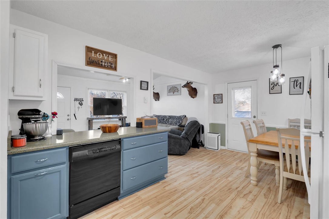 11 Trammell Street Liberty, SC 29657 - Photo 13 of 24 This inviting kitchen and dining area features durable flooring and functional appliances, perfect for everyday living.