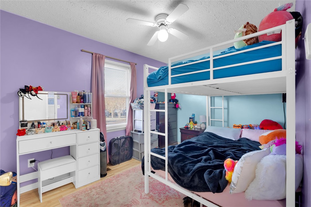 11 Trammell Street Liberty, SC 29657 - Photo 18 of 24 This spacious bedroom features ample natural light and durable wood flooring.