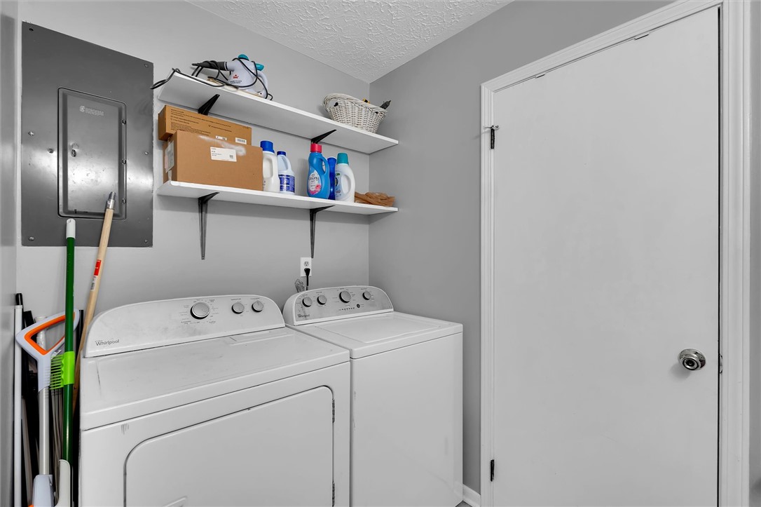 11 Trammell Street Liberty, SC 29657 - Photo 20 of 24 This dedicated laundry space offers practical convenience for daily chores.