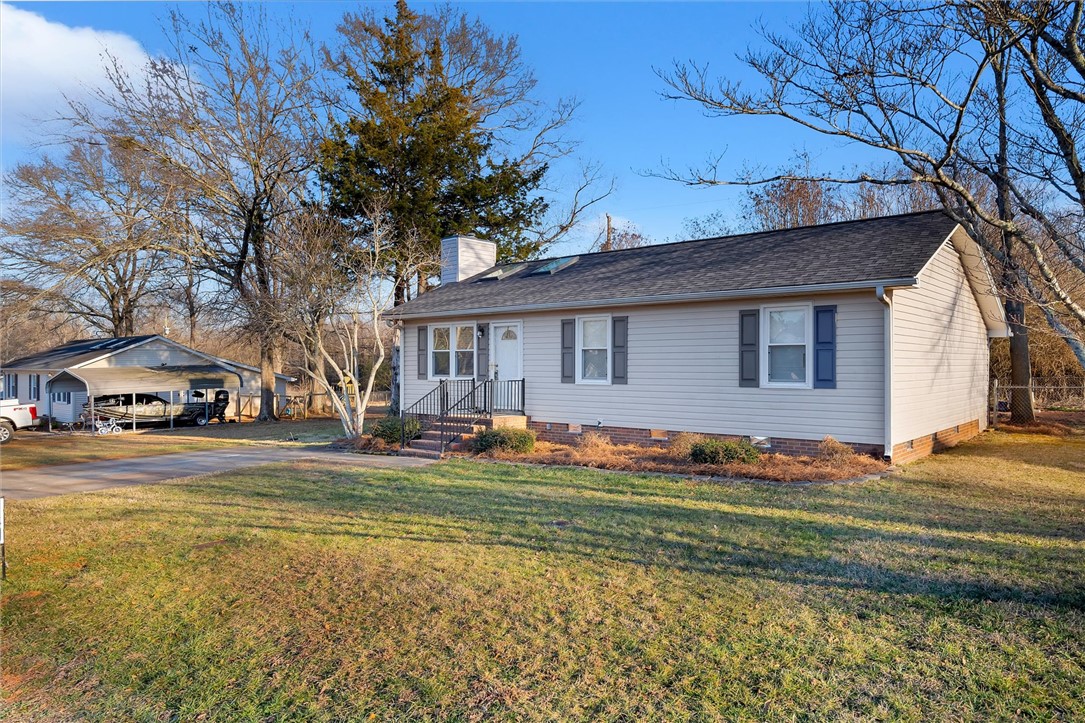 11 Trammell Street Liberty, SC 29657 - Photo 2 of 24 This inviting home offers classic appeal with a welcoming front entrance and spacious yard.