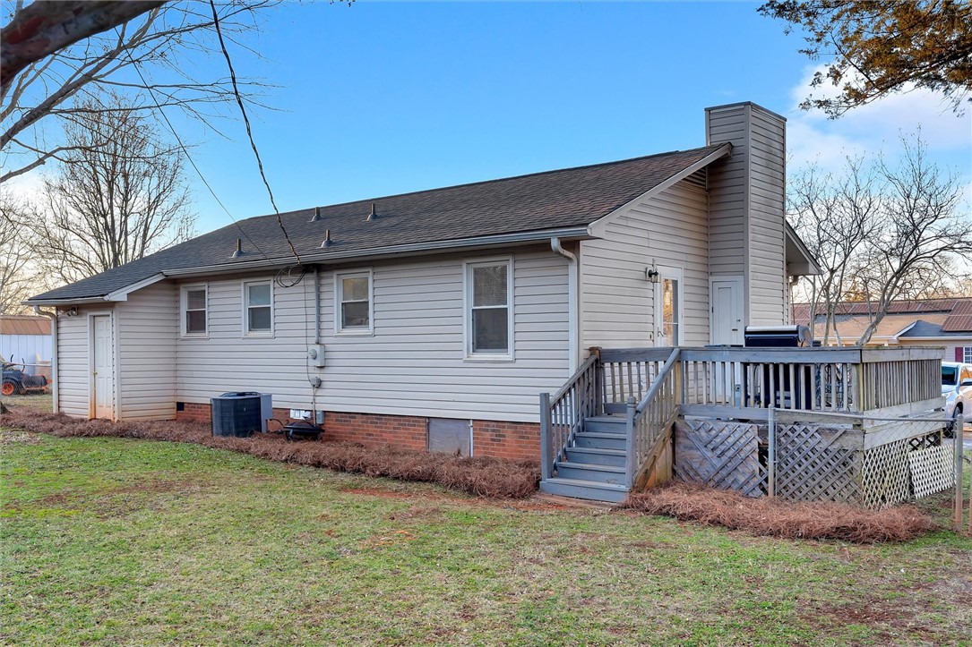 11 Trammell Street Liberty, SC 29657 - Photo 23 of 24 This charming home offers a welcoming exterior with a spacious deck perfect for outdoor enjoyment.