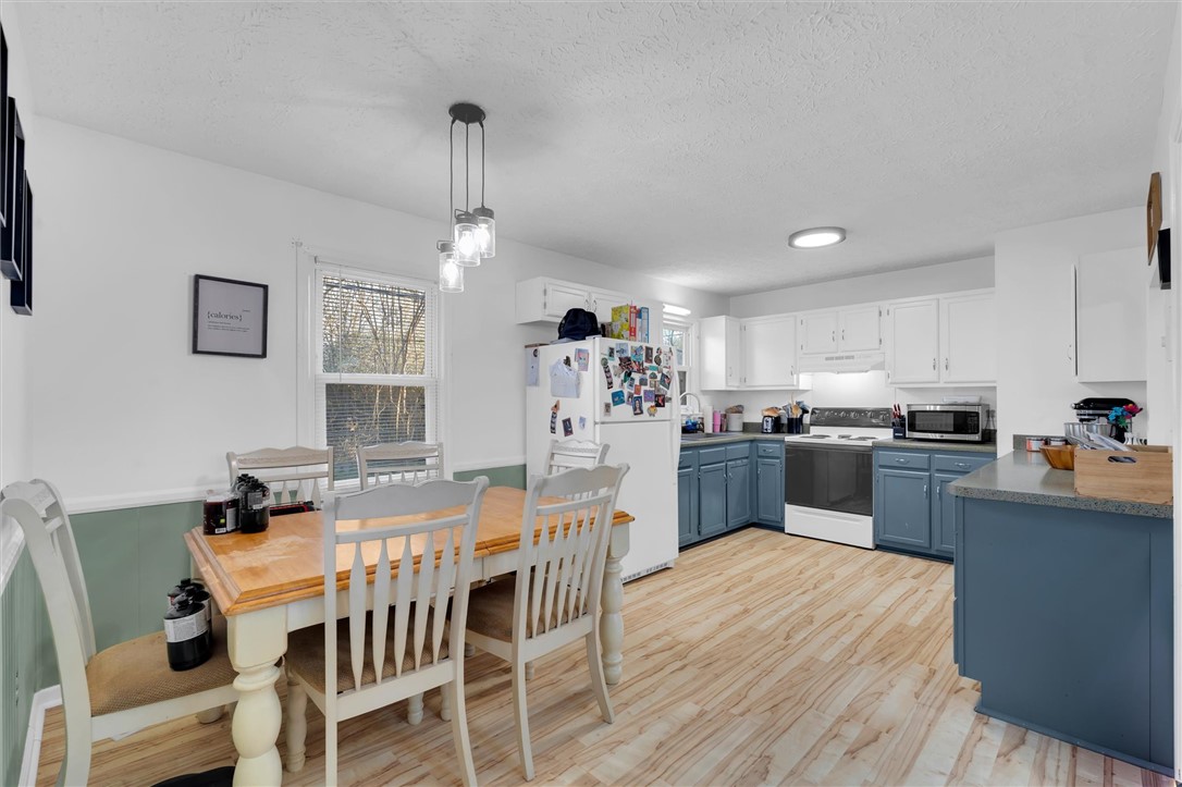 11 Trammell Street Liberty, SC 29657 - Photo 8 of 24 This bright kitchen with ample counter space offers a welcoming area for culinary creativity.