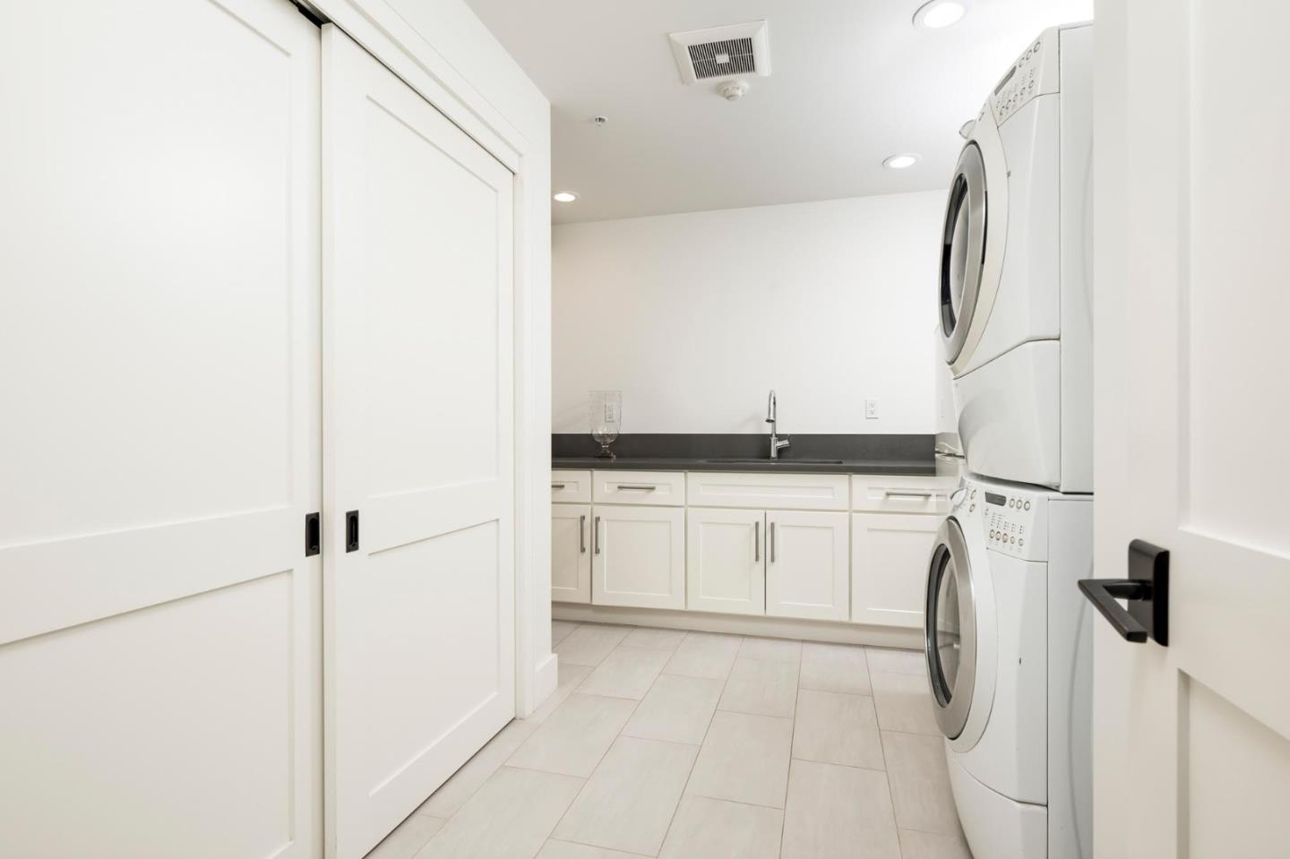 48 Middlegate Street Atherton, CA 94027 - Photo 24 of 27 a kitchen with a refrigerator and white cabinets
