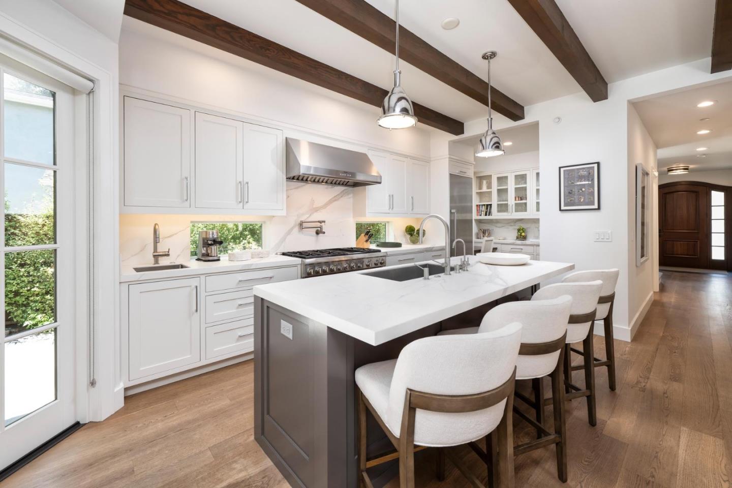 48 Middlegate Street Atherton, CA 94027 - Photo 5 of 27 a kitchen with a dining table chairs and white cabinets