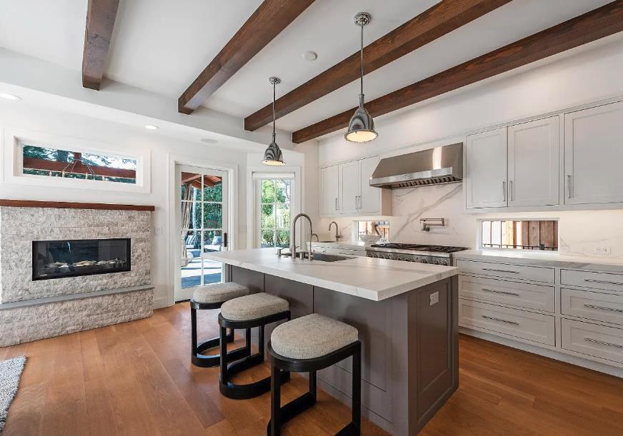 48 Middlegate Street Atherton, CA 94027 - Photo 8 of 27 a kitchen with stainless steel appliances a stove a table and chairs