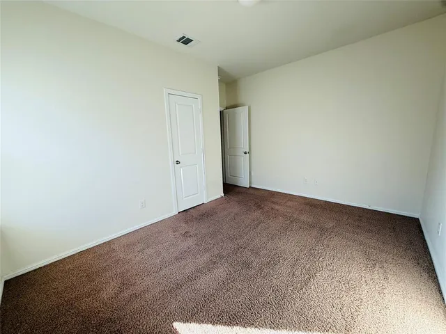 a view of an empty room and entryway