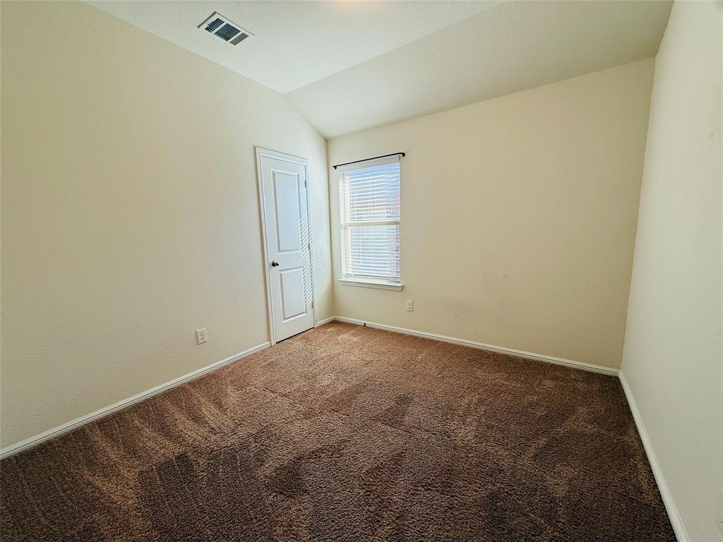 9328 Castorian Drive Fort Worth, TX 76131 - Photo 22 of 24 an empty room with a workbench