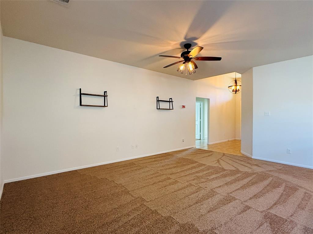9328 Castorian Drive Fort Worth, TX 76131 - Photo 6 of 24 a view of a big room with carpet