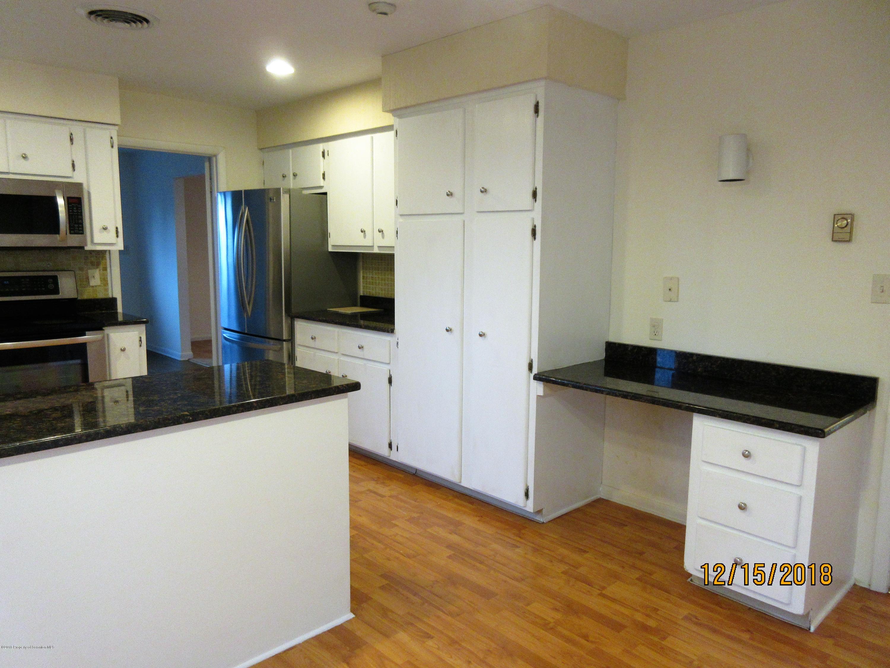 719 North Abington Road Clarks Summit, PA 18411 - Photo 11 of 37 a kitchen with stainless steel appliances a refrigerator sink and microwave