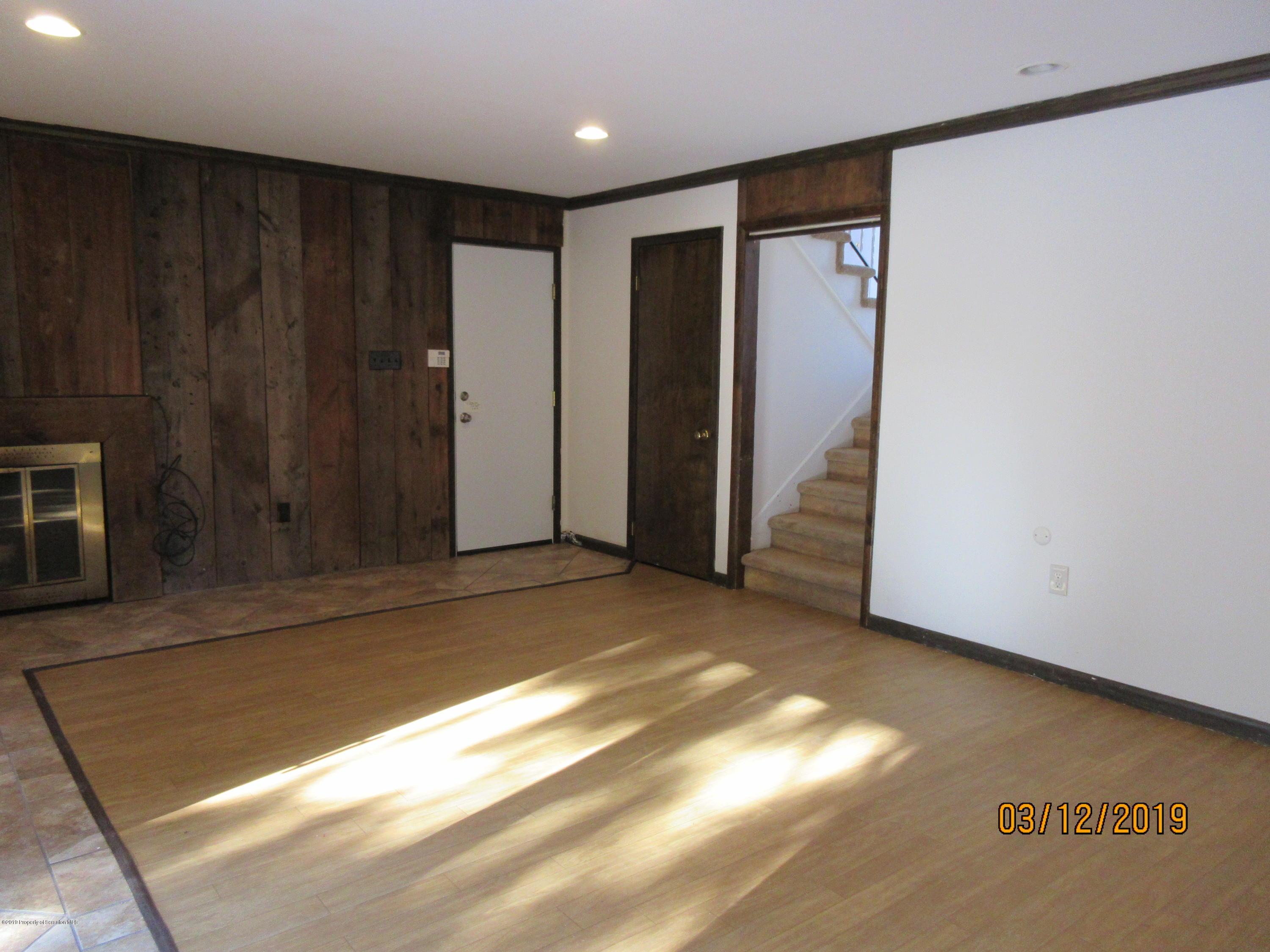 719 North Abington Road Clarks Summit, PA 18411 - Photo 21 of 37 a view of empty room with wooden floor and fan