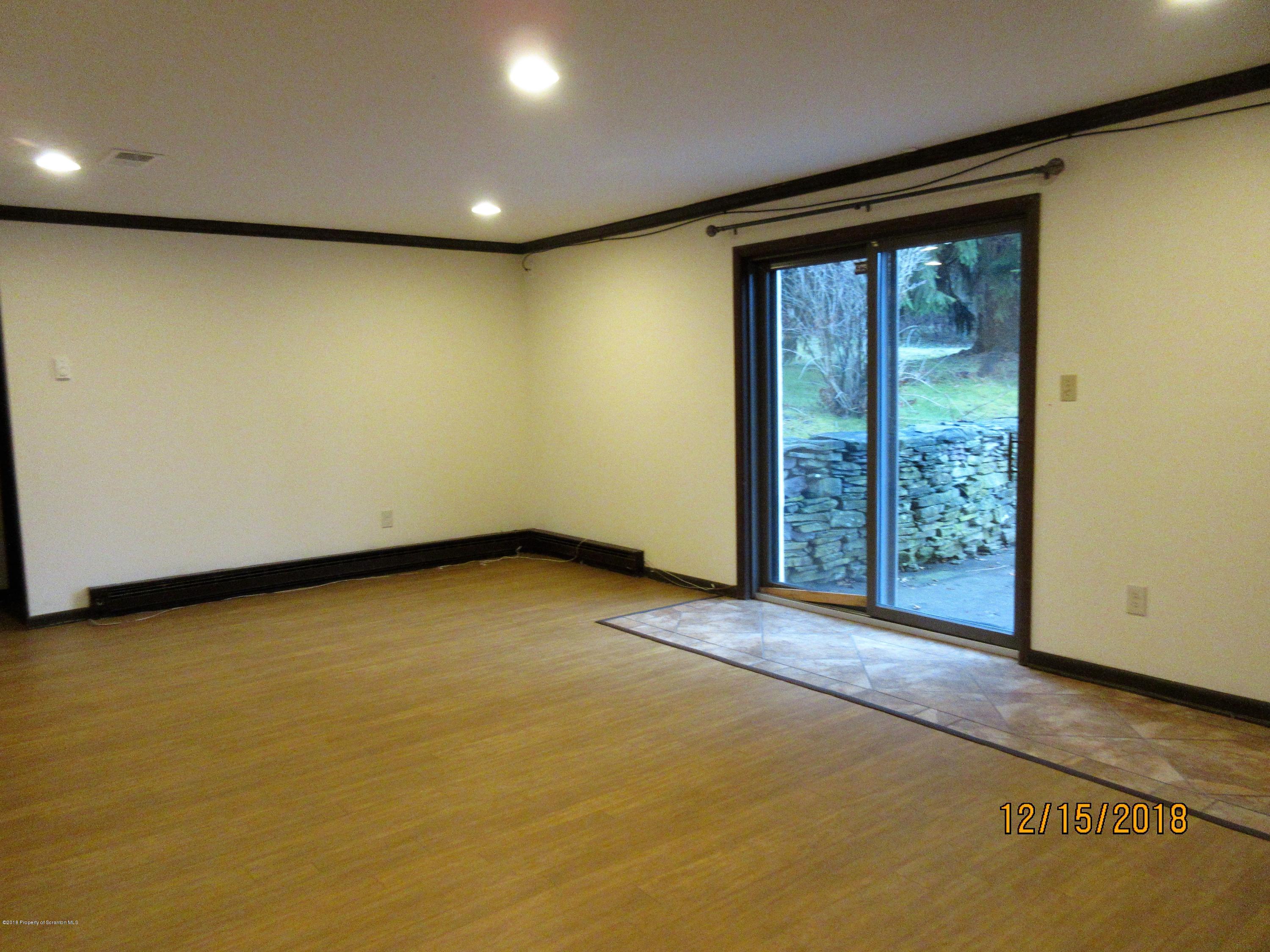 719 North Abington Road Clarks Summit, PA 18411 - Photo 22 of 37 a view of an empty room with a window