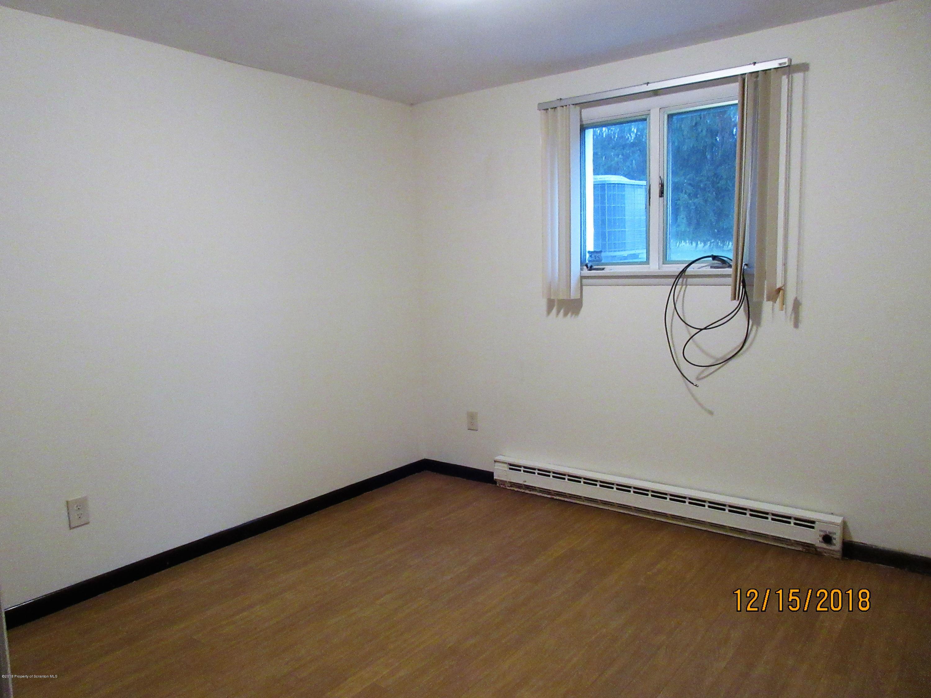 719 North Abington Road Clarks Summit, PA 18411 - Photo 26 of 37 a room with a fan and a window