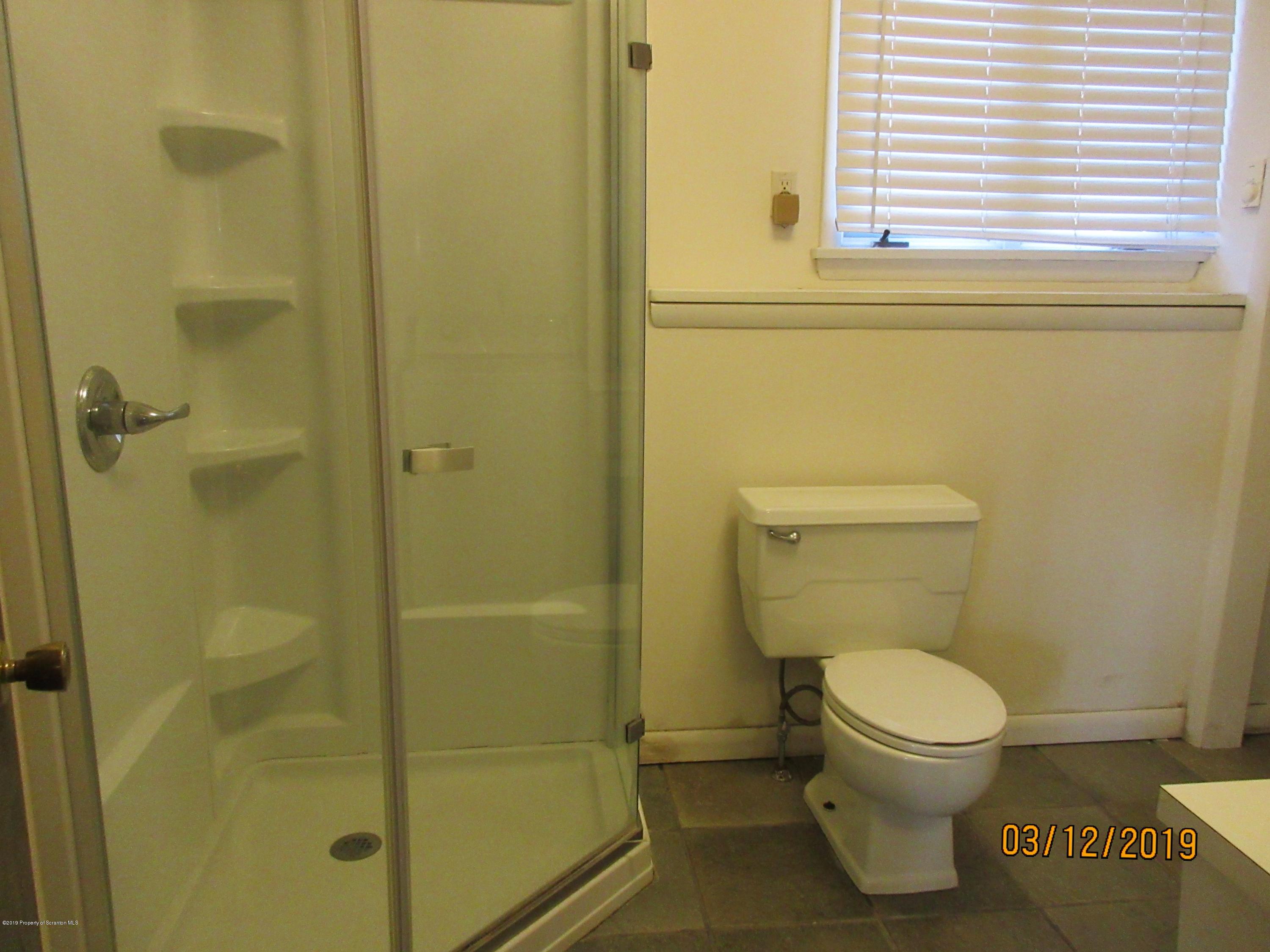 719 North Abington Road Clarks Summit, PA 18411 - Photo 30 of 37 a bathroom with a toilet and a shower