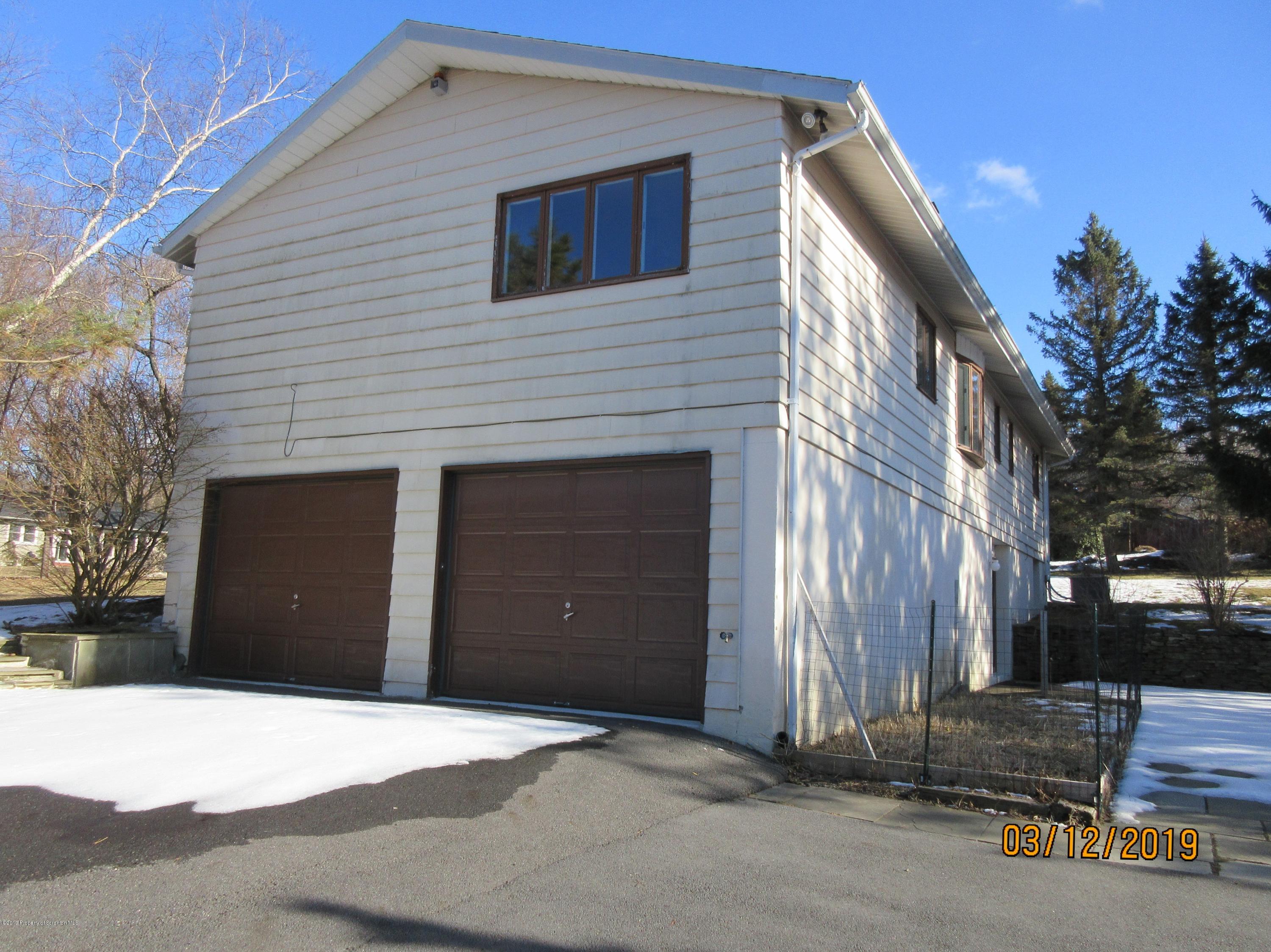 719 North Abington Road Clarks Summit, PA 18411 - Photo 33 of 37 a front view of a house with a garage