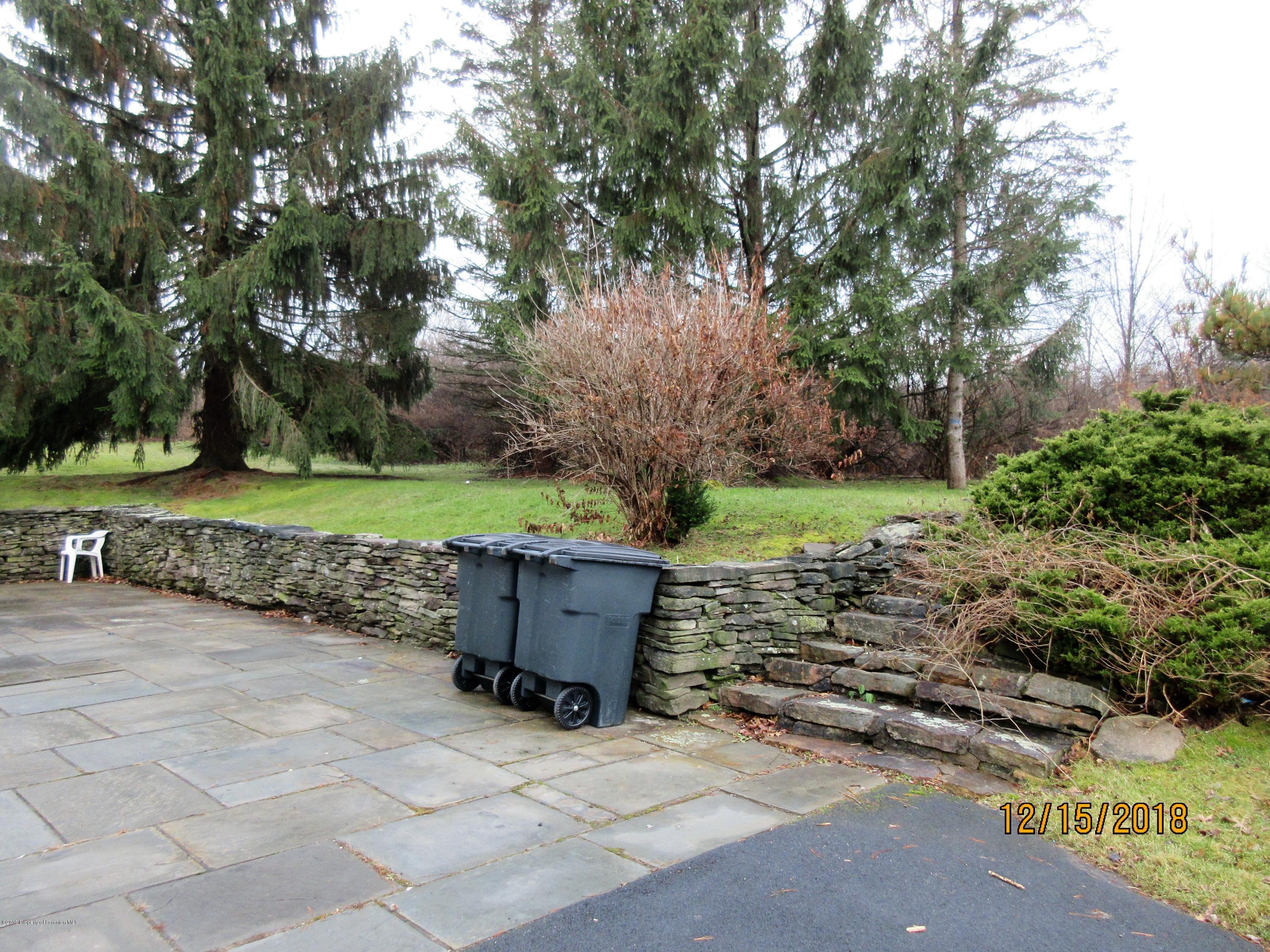 719 North Abington Road Clarks Summit, PA 18411 - Photo 36 of 37 a view of a backyard with large trees