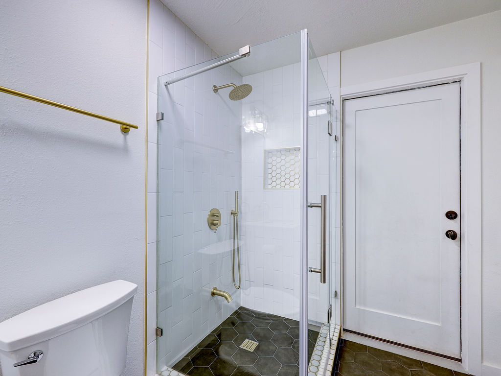 5842 Secrest Drive Austin, TX 78759 - Photo 39 of 40 A sleek, contemporary shower enclosure provides a refreshing bathing experience.