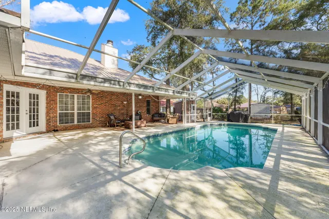 a view of a swimming pool with a patio