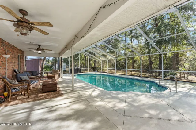 a view of a patio with a table and chairs