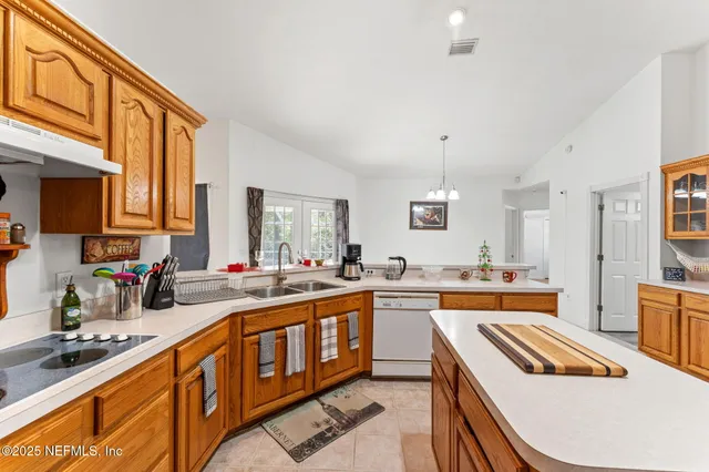 a kitchen that has a lot of cabinets in it