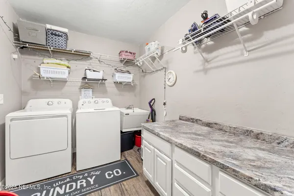 a bathroom with a double vanity sink mirror and shower
