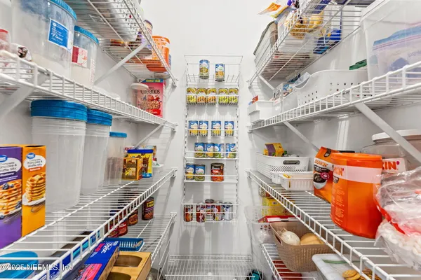 a kitchen that has a lot of cabinets in it