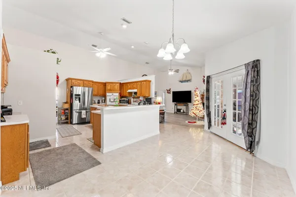 an living room with furniture and a flat screen tv