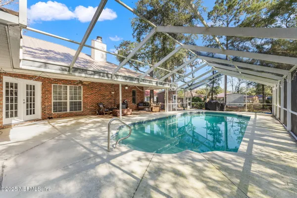 a view of a swimming pool with a patio