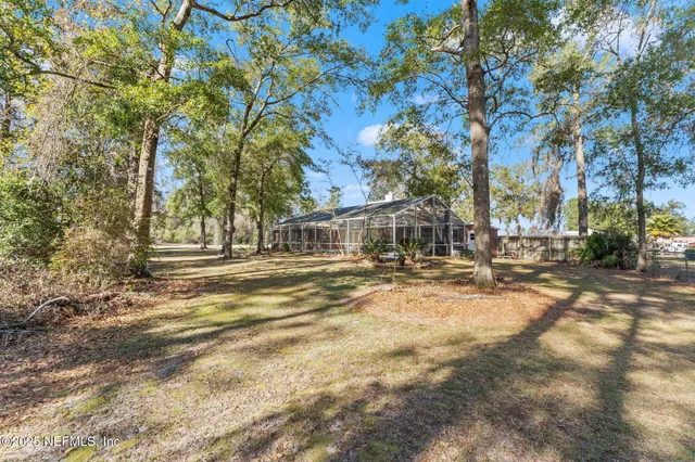 a view of a swimming pool with sitting area