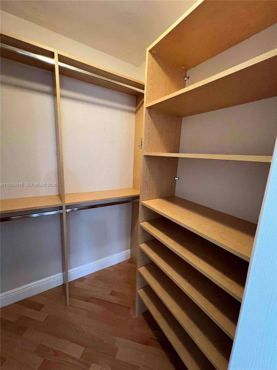 10785 Southwest 108th Avenue, Unit 308 Miami, FL 33176 - Photo 11 of 21 a view of walk in closet with empty racks