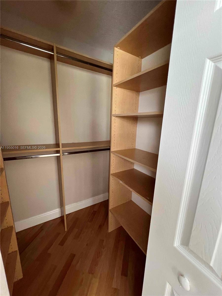 10785 Southwest 108th Avenue, Unit 308 Miami, FL 33176 - Photo 12 of 21 a view of walk in closet with empty racks