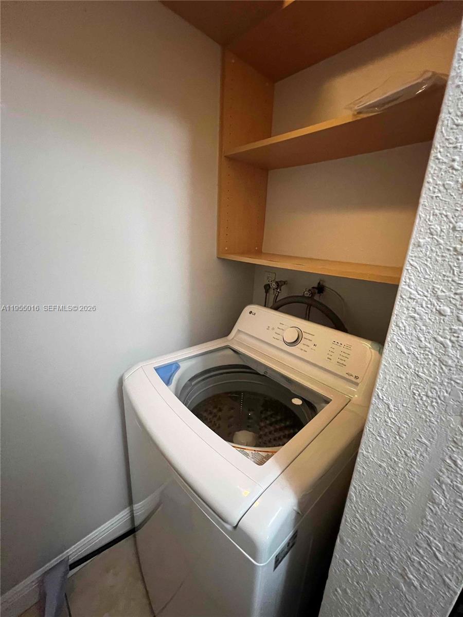 10785 Southwest 108th Avenue, Unit 308 Miami, FL 33176 - Photo 15 of 21 a stove top oven sitting inside of a kitchen