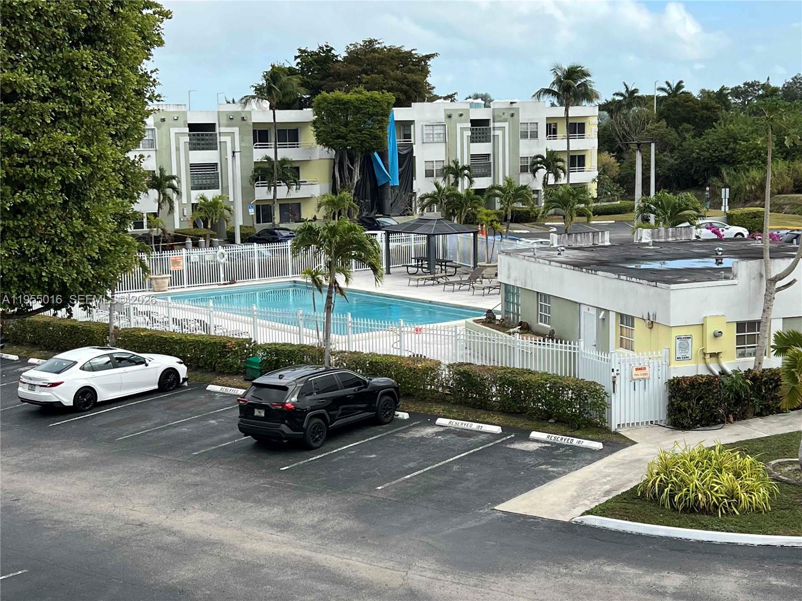 10785 Southwest 108th Avenue, Unit 308 Miami, FL 33176 - Photo 21 of 21 a view of street with parked cars