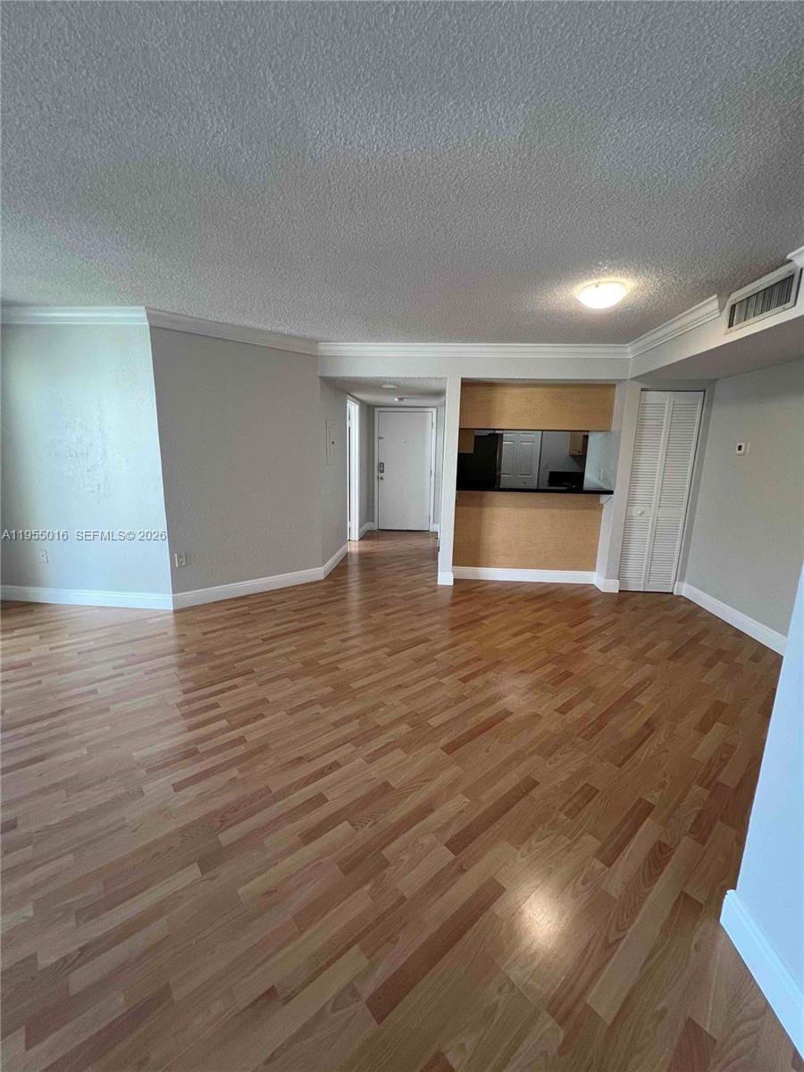 10785 Southwest 108th Avenue, Unit 308 Miami, FL 33176 - Photo 5 of 21 a view of empty room with wooden floor