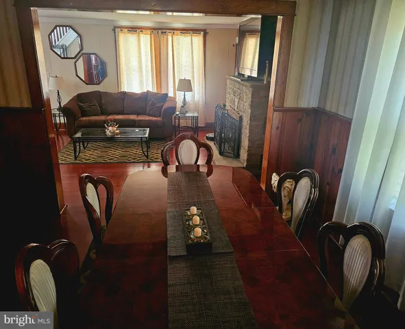a view of a dinning room with furniture and window