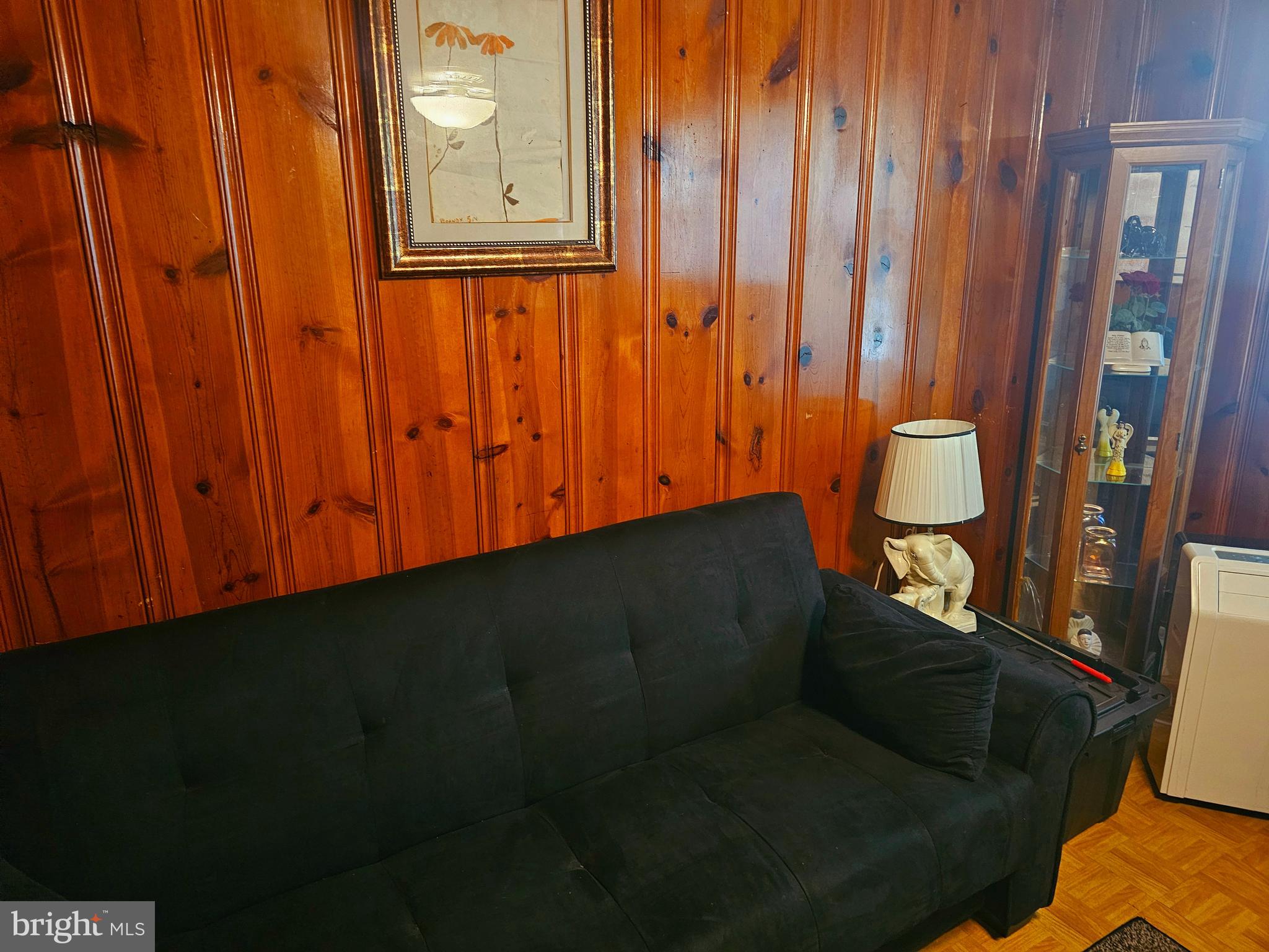 3506 Bayer Avenue Randallstown, MD 21133 - Photo 13 of 36 a view of a door and chair in wooden floor