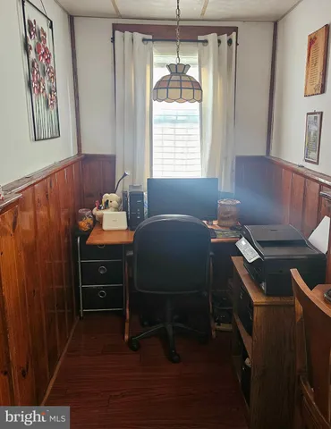 a room with two chair and appliances