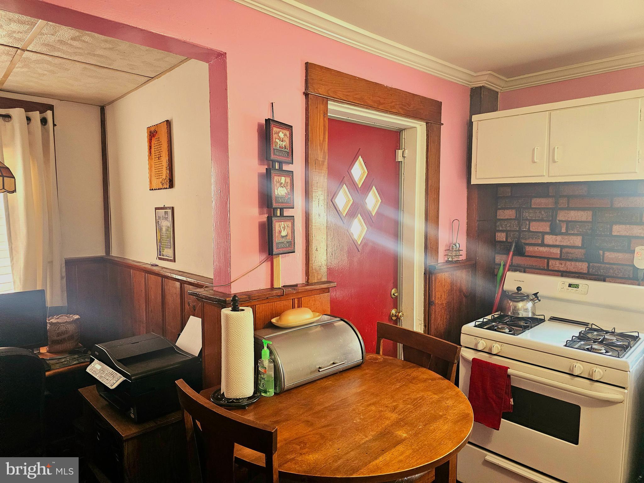 3506 Bayer Avenue Randallstown, MD 21133 - Photo 16 of 36 a room with two chair and appliances