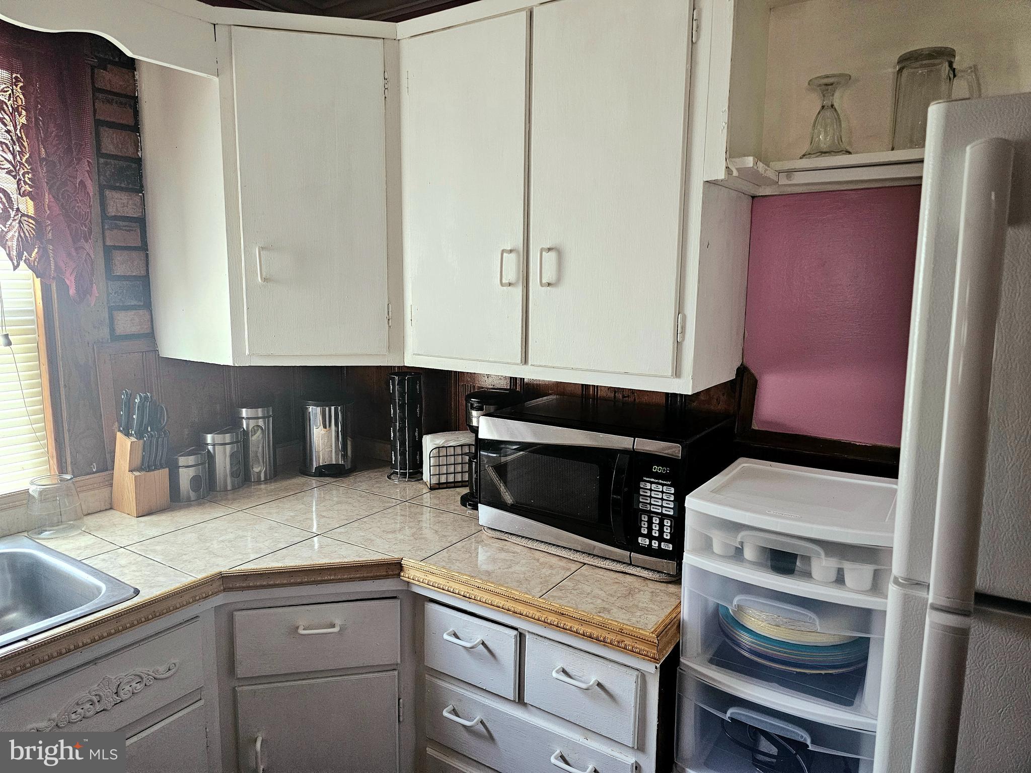 3506 Bayer Avenue Randallstown, MD 21133 - Photo 18 of 36 a kitchen with a sink and cabinets