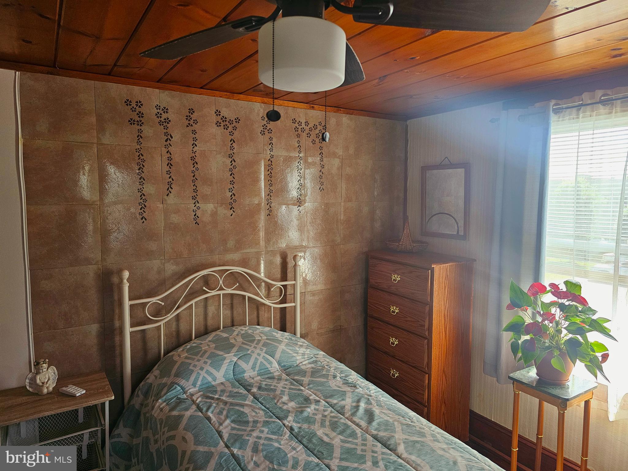 3506 Bayer Avenue Randallstown, MD 21133 - Photo 21 of 36 a bedroom with a bed dresser and a window