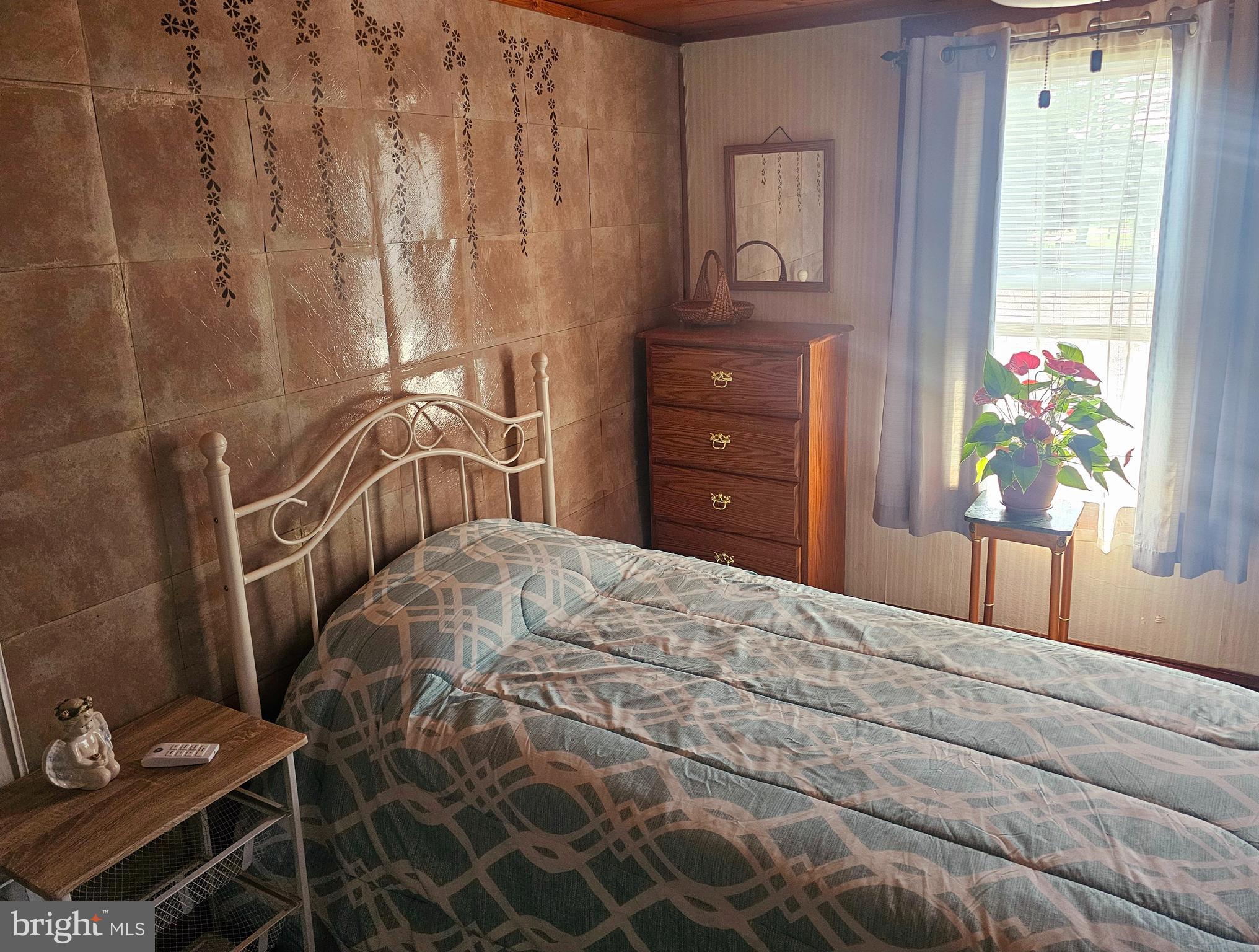 3506 Bayer Avenue Randallstown, MD 21133 - Photo 22 of 36 a bedroom with a bed dresser and a window