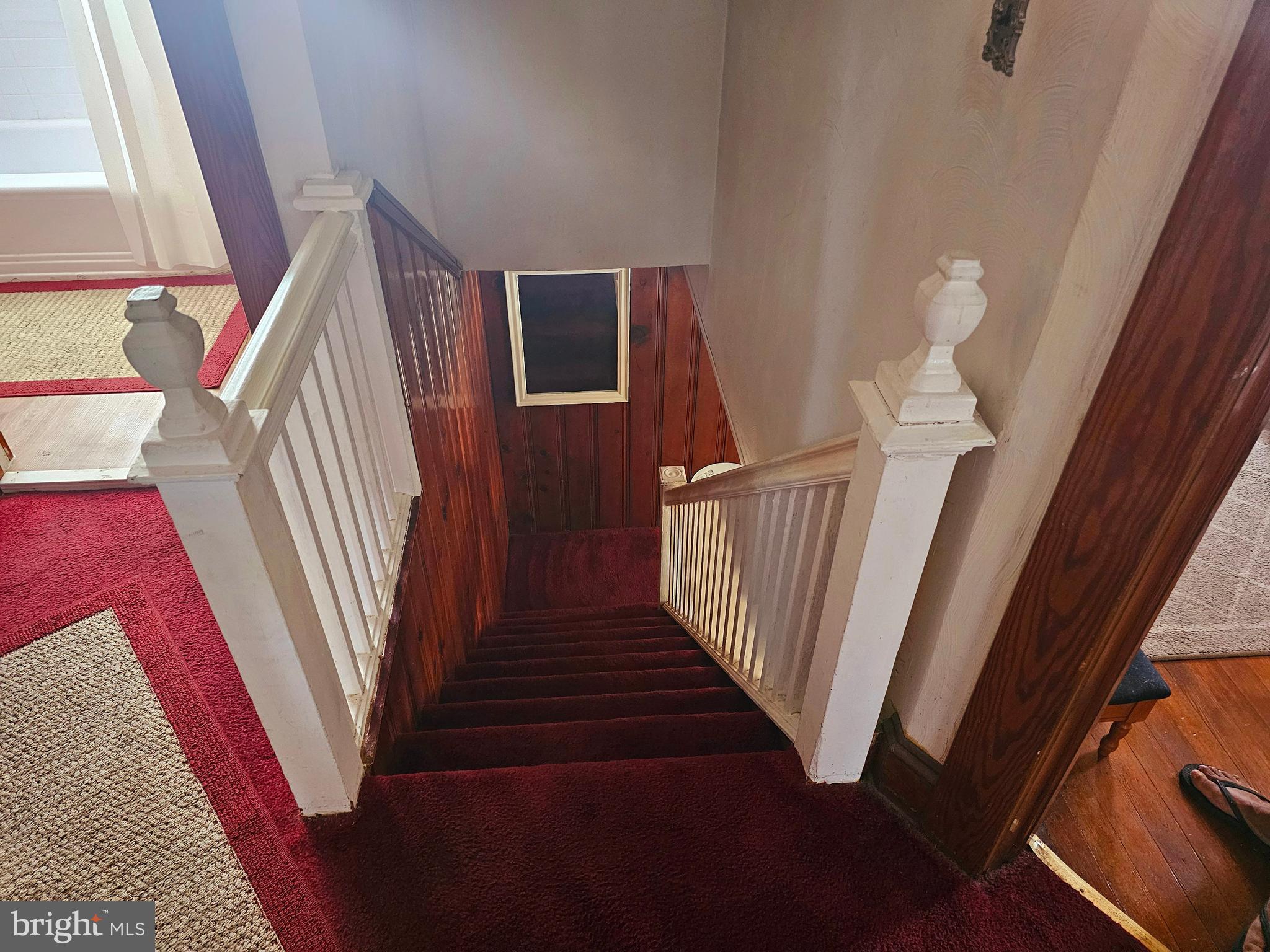3506 Bayer Avenue Randallstown, MD 21133 - Photo 27 of 36 a view of a livingroom with wooden floor and stairs