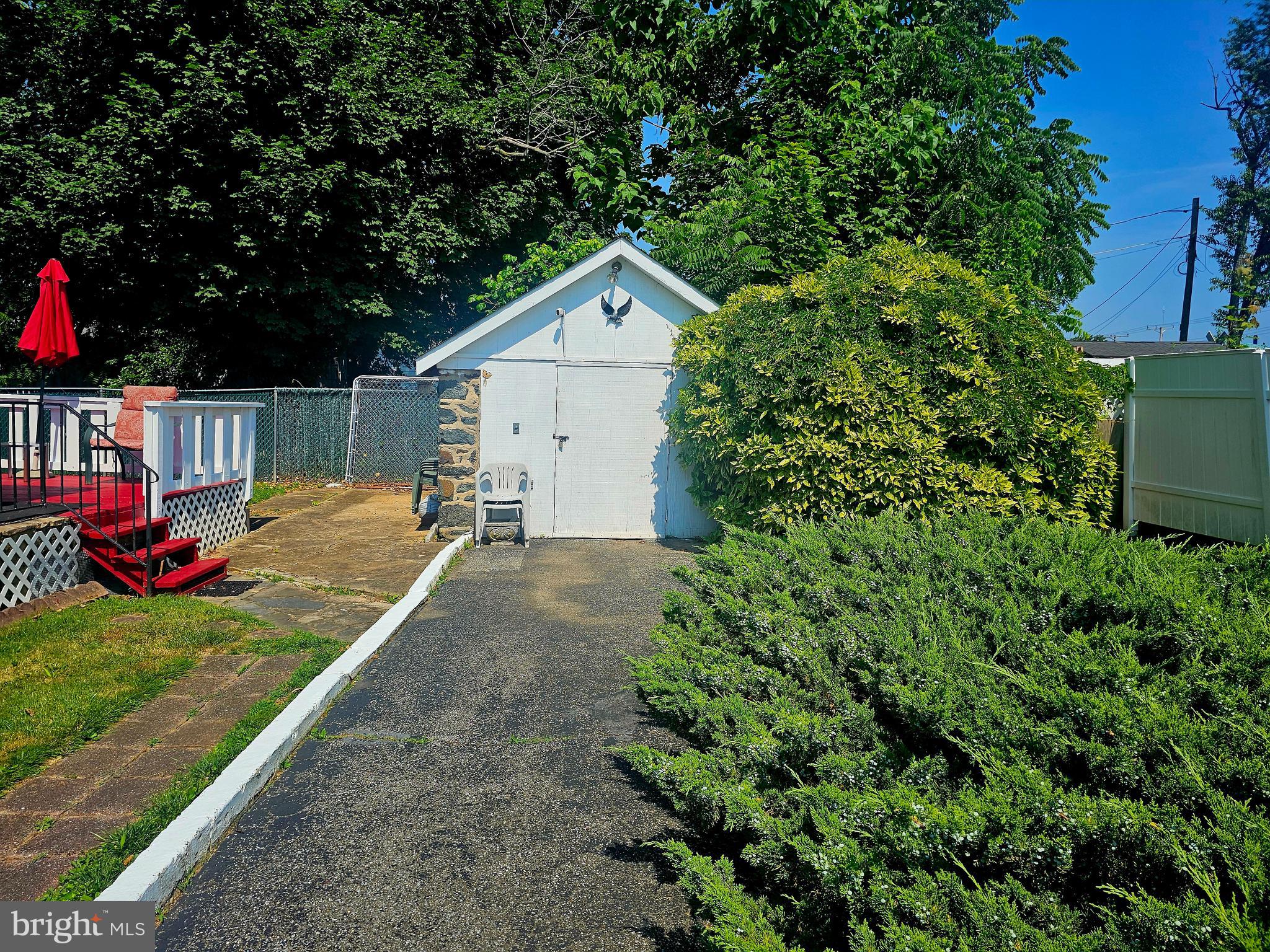 3506 Bayer Avenue Randallstown, MD 21133 - Photo 35 of 36 a backyard of a house with table and chairs