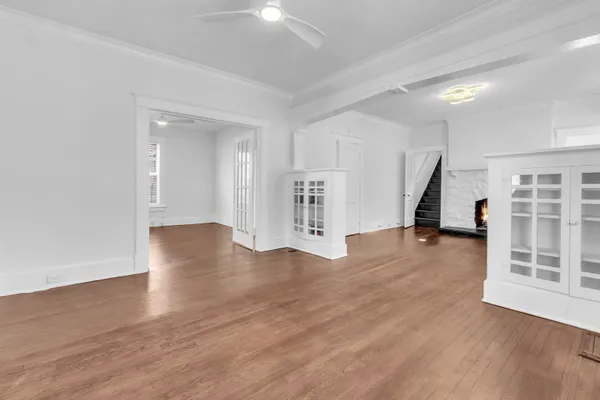 wooden floor in an empty room with a window
