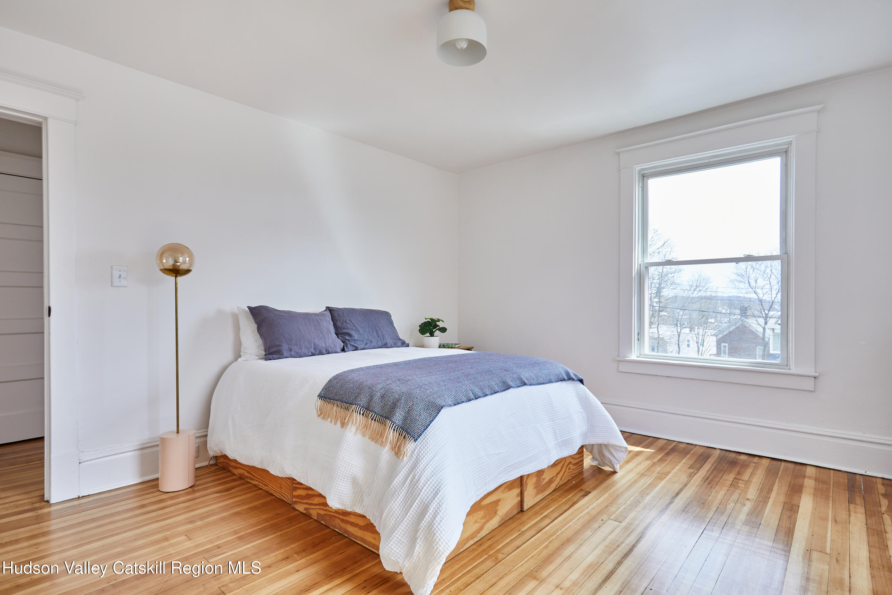 15 Summit Avenue Catskill, NY 12414 - Photo 20 of 28 a bedroom with a bed and wooden floor