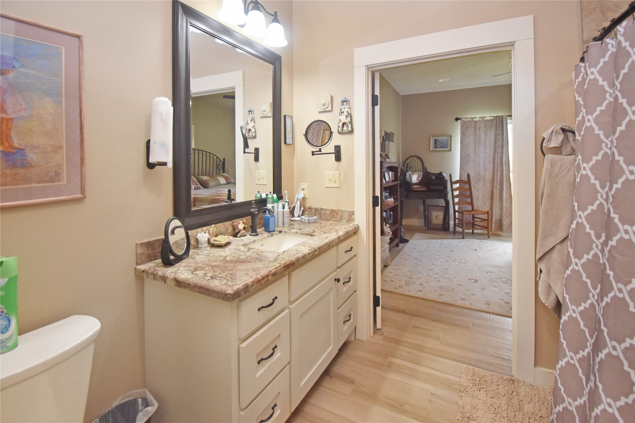 115 Pr 5250 Warren, TX 77664 - Photo 11 of 21 a bathroom with a granite countertop sink a toilet a mirror and shower